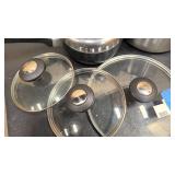 Wok with cover, misc pots and covers