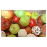 Box of decorative fruit, woven balls, and other dcor