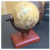 Rustic living décor = small wooden globe, large painted metal pear, and rustic wooden box with handle