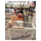 Wood spindle tenonizer. Commercial tenon cutting machinery for log furniture, timber framing, and handrail construction