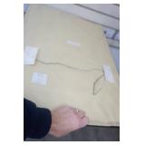 Framed Wall Hanging with an Ornate Metal Medallion Design