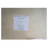 Framed Wall Hanging with an Ornate Metal Medallion Design