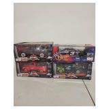 Collection of 4 Die-Cast Vehicles Including Harley-Davidson Trucks and Dale Earnhardt Stock Car