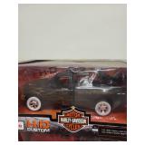 Collection of 4 Die-Cast Vehicles Including Harley-Davidson Trucks and Dale Earnhardt Stock Car