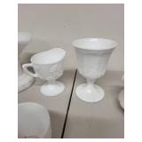 Collection of White Milk Glass Cups and Serving Pieces with Embossed Designs