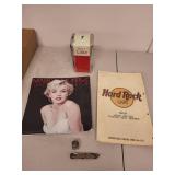 Vintage Collectibles Lot with 1992 Coca-Cola Napkin Dispenser, Marilyn Monroe Calendar, Hard Rock Cafe Menu, and More