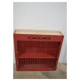 Red Wall-Mount Plate Rack and Ornate Wood Mirror