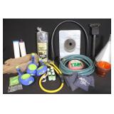 Collection of Lawn and Garden Supplies Including Hose, Mulch Film, Extension Cord, and Accessories