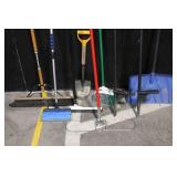 Collection of Yard and Snow Tools with Shovels, Brooms, Rake, and Snow Pusher