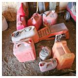 Gas Can Lot with a pair of Car Ramps