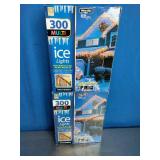 2 Boxes, Holiday branded 300-count multi-color incandescent icicle lights with white wire.