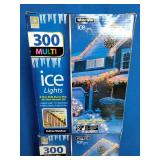 2 Boxes, Holiday branded 300-count multi-color incandescent icicle lights with white wire.