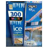 2 Boxes, Holiday branded 300-count multi-color incandescent icicle lights with white wire.