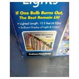 2 Boxes, Holiday branded 300-count multi-color incandescent icicle lights with white wire.