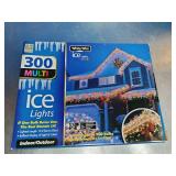 2 Boxes, Holiday branded 300-count multi-color incandescent icicle lights with white wire.