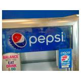 Countertop Pepsi display refrigerator.