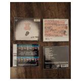 4 Rolling Stones music albums and concert films on CD or DVD format: