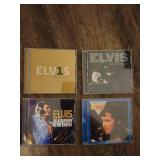 collection of Elvis Presley music CDs, which are collectible items.