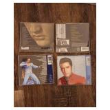 collection of Elvis Presley music CDs, which are collectible items.