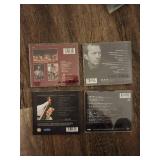 4 Eric Clapton music CDs.
