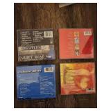 4 Beatles CDs.