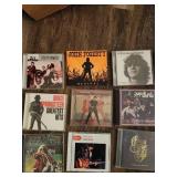 Collection of 25 rock music CDs, which are considered collectibles.