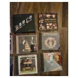 Collection of 25 rock music CDs, which are considered collectibles.