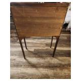 Antique slant-top desk, also known as a secretary desk or bureau.