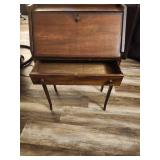 Antique slant-top desk, also known as a secretary desk or bureau.