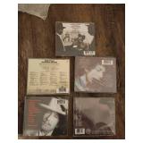 5 Bob Dylan music CDs.