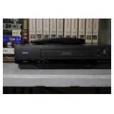 RCA VHS VCR with Remote, User Guide, and 24 Movie VHS Tapes Lot