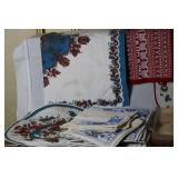 Collection of Vintage Table Linens, Placemats, and Runners with Embroidery and Woven Designs