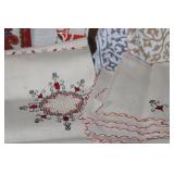 Collection of Vintage Table Linens, Placemats, and Runners with Embroidery and Woven Designs