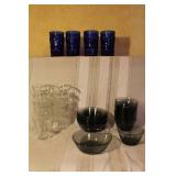 Vintage Glassware Set with Blue Tumblers, Clear Glasses, and Dark Bowls