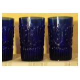 Vintage Glassware Set with Blue Tumblers, Clear Glasses, and Dark Bowls