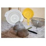 Large Kitchenware Collection with Strainers, Scales, Bowls, Baskets, and Tools