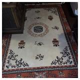 Asian-Inspired Area Rug with Decorative Vases and Geometric Border