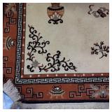 Asian-Inspired Area Rug with Decorative Vases and Geometric Border