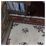 Asian-Inspired Area Rug with Decorative Vases and Geometric Border