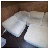 Beige Sectional Sofa with Ottoman and Chevron Pattern Upholstery