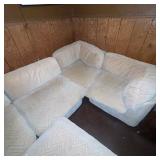 Beige Sectional Sofa with Ottoman and Chevron Pattern Upholstery