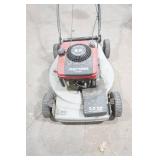 Craftsman gas-powered, self-propelled walk-behind lawn mower.