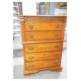 Wooden 5-drawer dresser with ornate brass-toned hardware