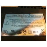 XBox with Controllers and Games