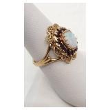 Beautiful Opal and Garnet Ring Set in 10K Yellow Gold - Size 6.75