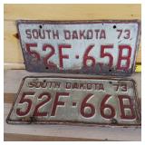 1973 Consecutive one digit apart plates embossed full size 1973 from South Dakota