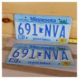 Matching set 2002 Minnesota embossed full size plates