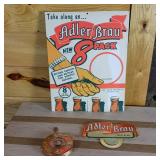 Adler Brau lot with Brand New Reusable Box, ad sign and Take along an Adler 8 Pack sign.