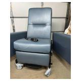 MSRP $8000 Champion mobile power patient recliner features electric recline, integrated seat heating, swing-out armrests for easier entry/exit, a flip-up tray table & hospital-grade designed for l