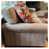 SR - Grey Upholstered Couch with Floral and Green Throw Pillows
